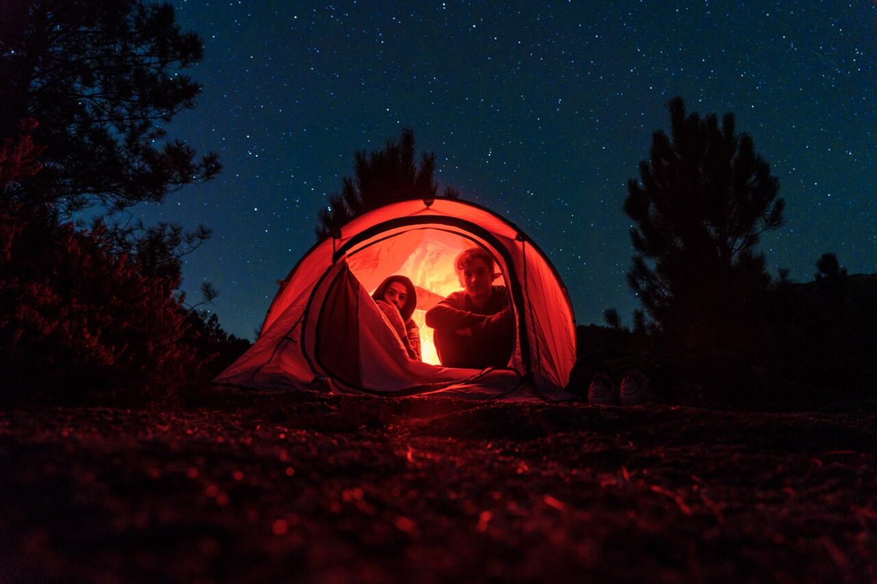 Jonas and Pelle look out of their tent as the stars shine bright above forest of Geres.